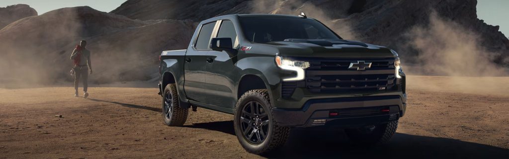 2026 Chevrolet Silverado 1500 full-size pickup truck displayed in an off-road desert environment, highlighting powerful performance, advanced 4x4 capability, and durable design.
