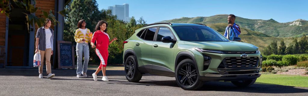 2026 Chevy Trax showcased in a residential setting with a scenic hillside backdrop.